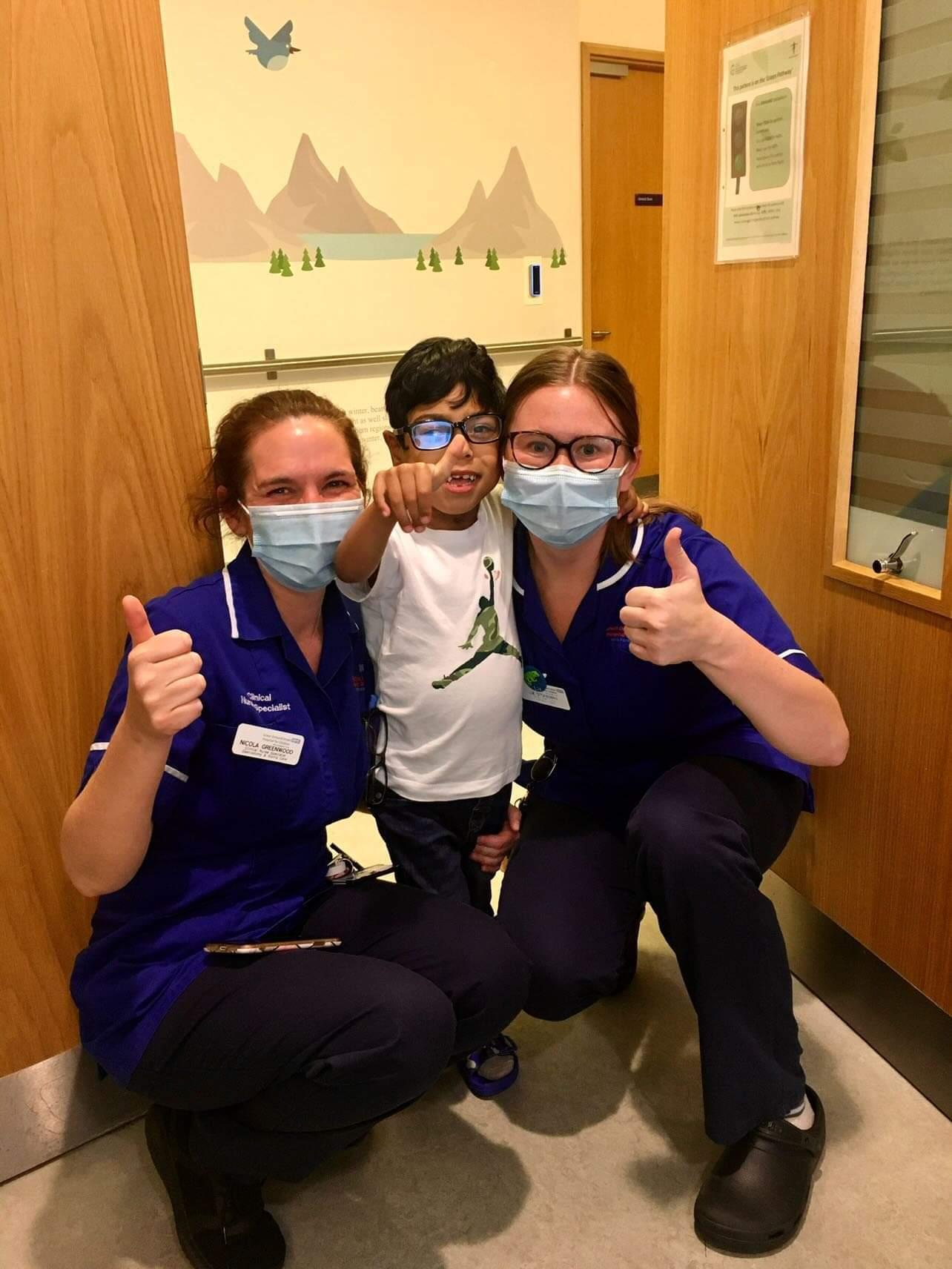 Omar at Gosh with his nurses