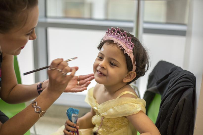 Little girl having her facepainted 