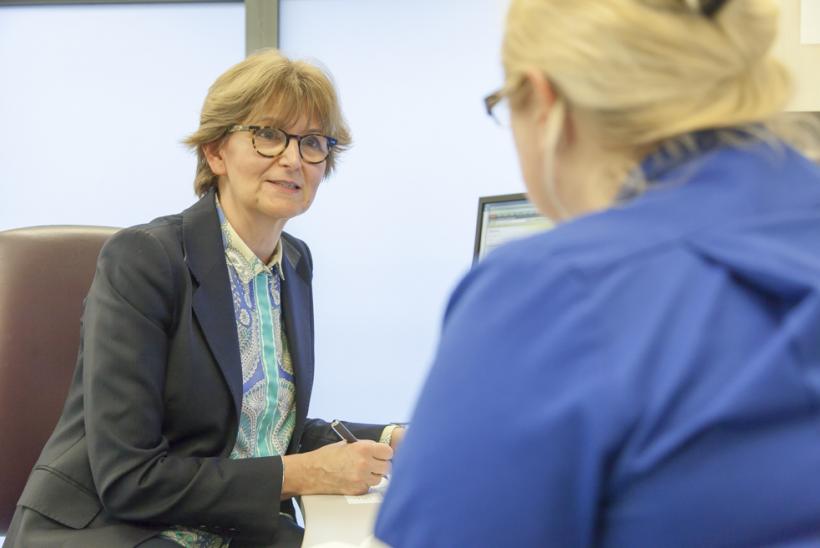 Consultant and nurse talking