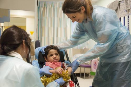 Ahmed enjoying a session with his Occupational Therapists